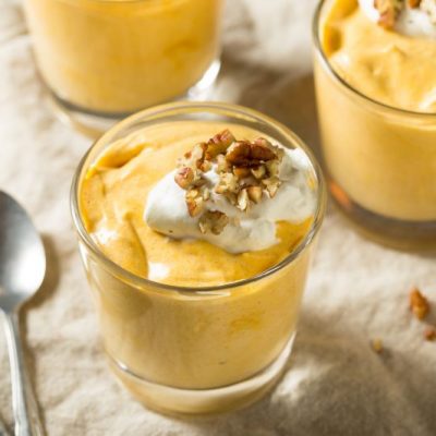 Three Glass Cups of Pumpkin Pudding Topped with Greek Yogurt and Maple Granola