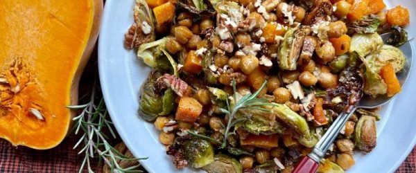 Maple-Balsamic Brussels and Chickpea Bake with Roasted Squash, Figs, and Pecans on a White Plate
