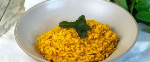 Sage and Brown Butter Pumpkin Risotto_Resized Image_Ryan Shepherd Pumpkin Risotto with Fried Sage Leaves on Top in a Big, Deep Bowl