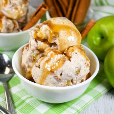 A Bowl of Vegan Apple Pie Ice Cream is Covered With a Drizzle of Caramel Sauce.