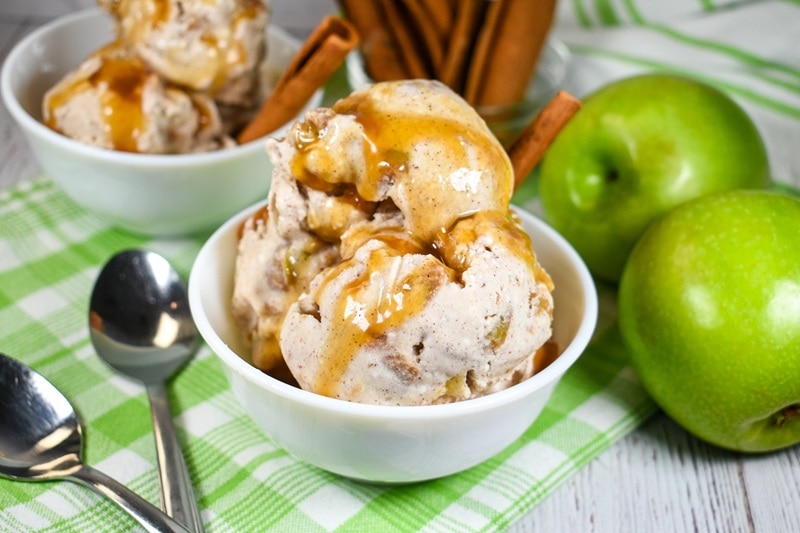 A Bowl of Vegan Apple Pie Ice Cream is Covered With a Drizzle of Caramel Sauce.
