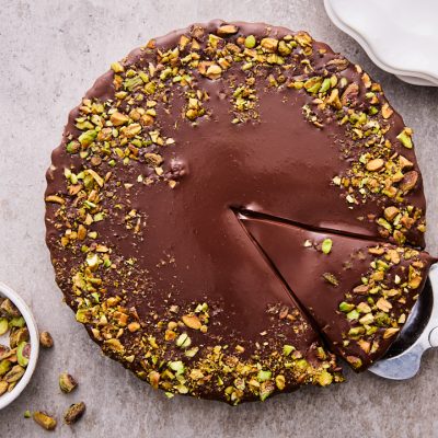 Dark Chocolate Pistachio Tart On Table Ready For Serving