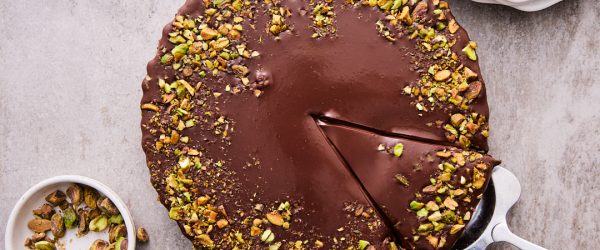 Dark Chocolate Pistachio Tart On Table Ready For Serving