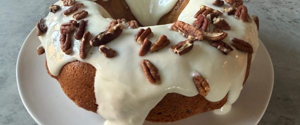 Maple Pecan Bundt Cake With Frosting On Counter