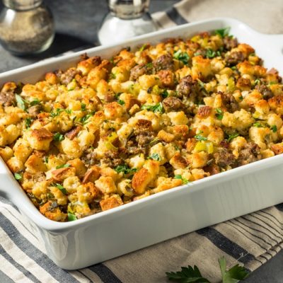 A Casserole of Low FODMAP Stuffing is Garnished With Fresh Herbs.