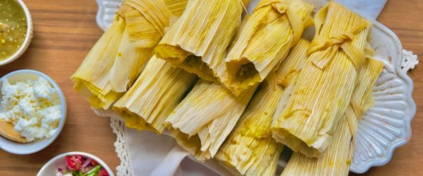 Savory Pumpkin Tamales With Dips on Wood Table