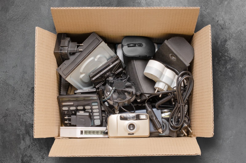 Overhead View of Box Filled With Old Electronics to Represent Concept of What is E-Waste
