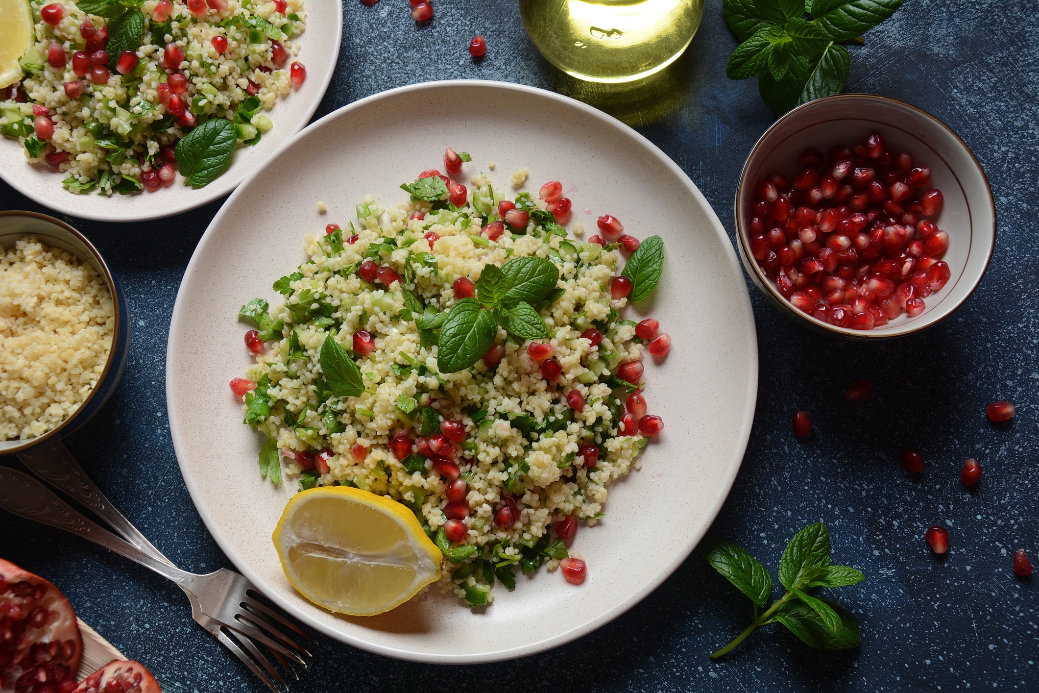 Bejeweled Couscous Salad on Table With Lemon