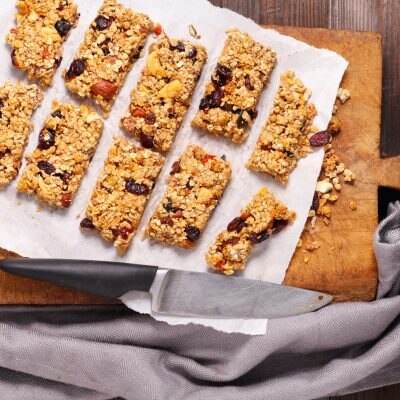 High-Protein Chewy Granola Bars on Wood Cutting Board
