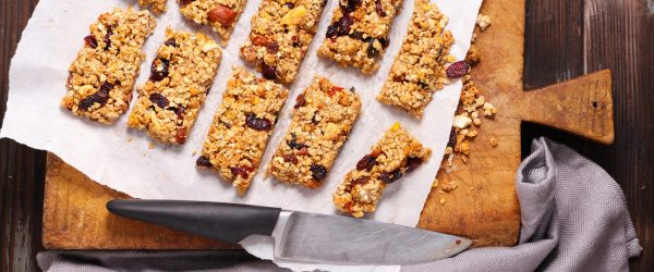 High-Protein Chewy Granola Bars on Wood Cutting Board