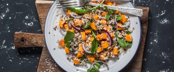 Nourishing Winter Salad With Roasted Vegetables Nourishing Winter Salad With Roasted Vegetables on Dark Background