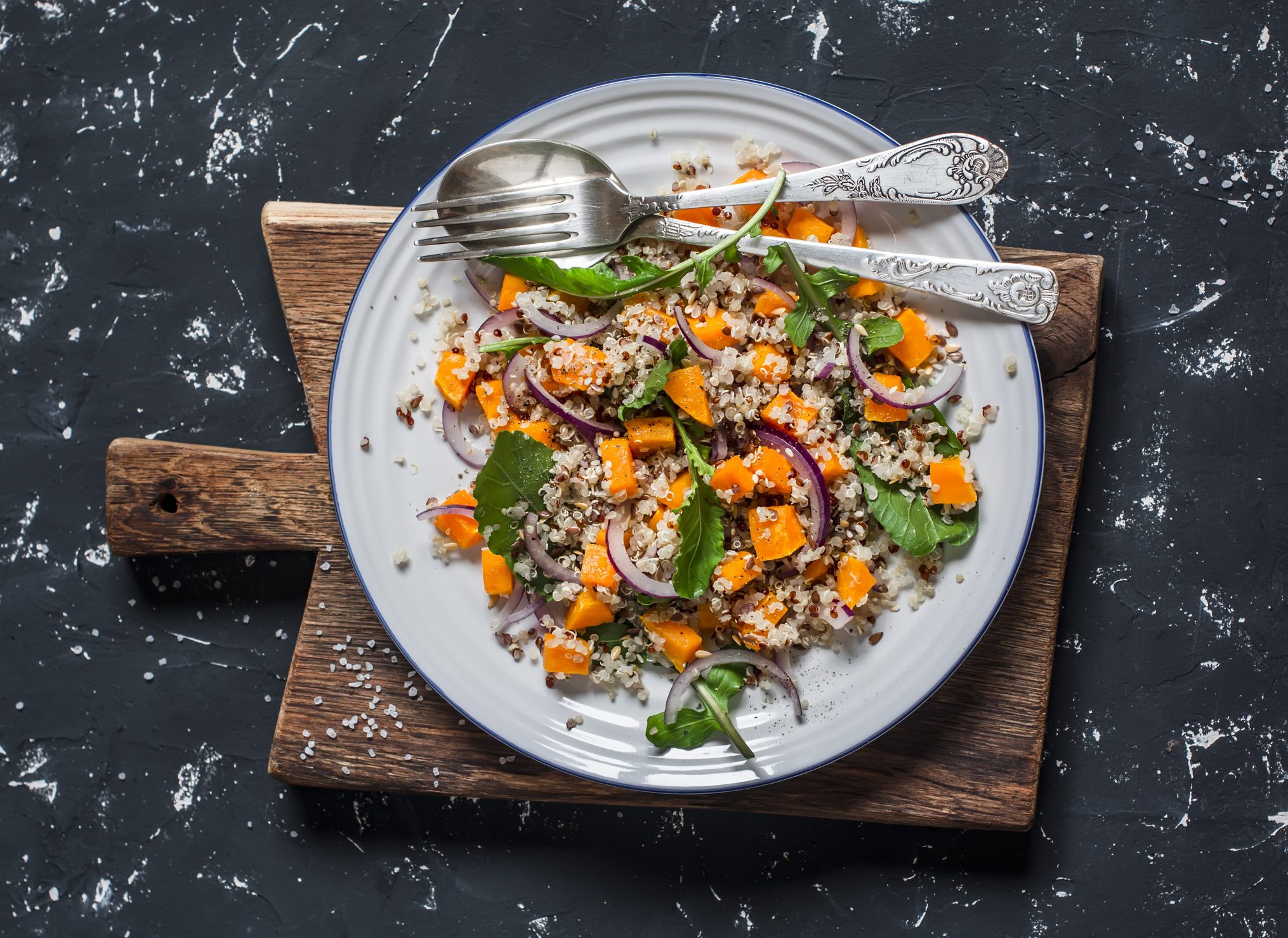 Nourishing Winter Salad With Roasted Vegetables on Dark Background