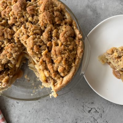 Vegan Dutch Apple Pie and Slice on Counter With Napkin