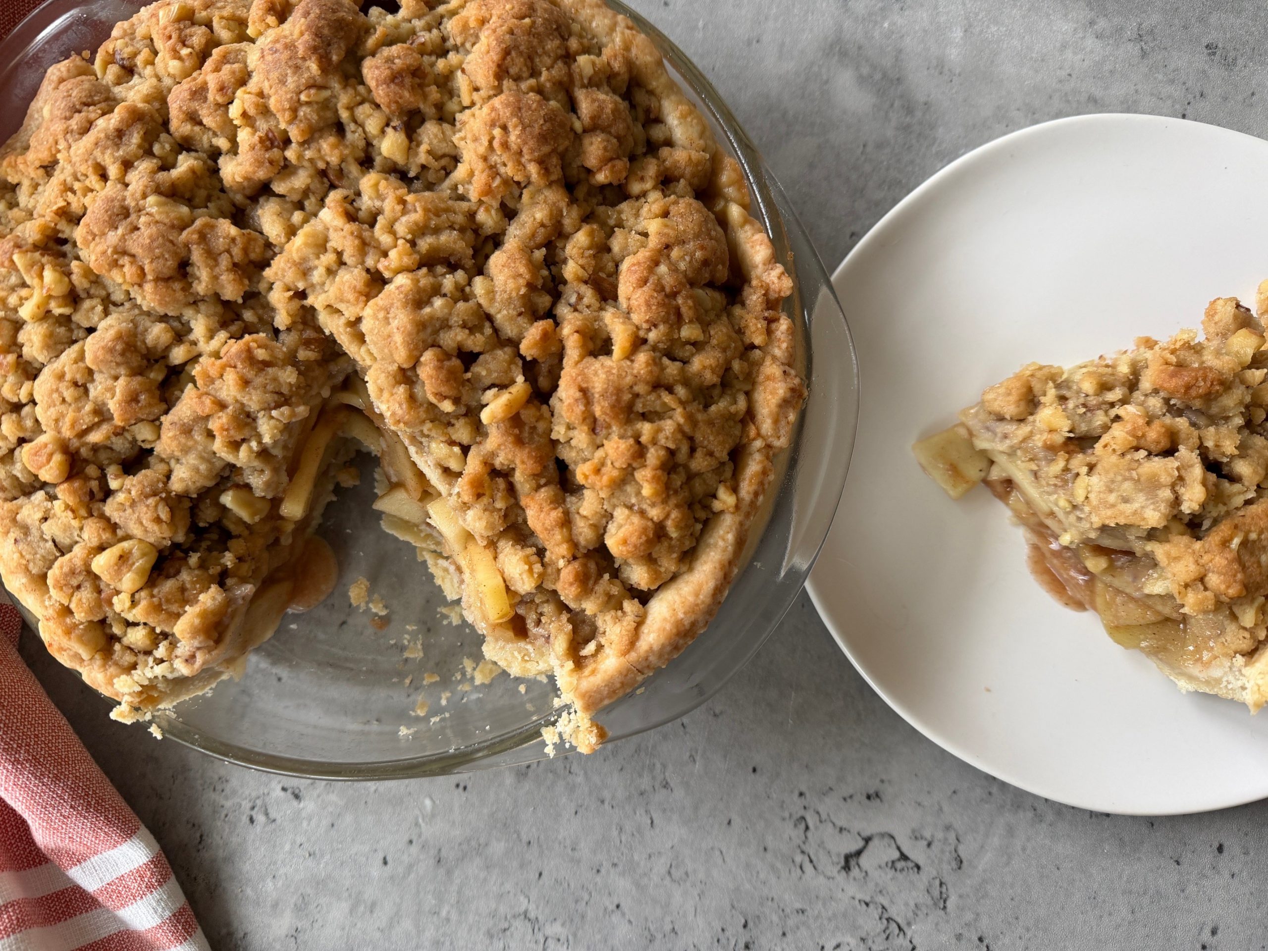 Vegan Dutch Apple Pie and Slice on Counter With Napkin
