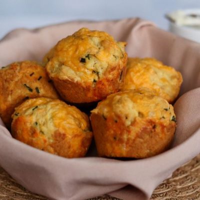 Savory Muffins: Chive and Cheddar Muffins Nestled in a Linen-lined Bowl