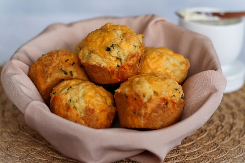 Savory Muffins: Chive and Cheddar Muffins Nestled in a Linen-lined Bowl