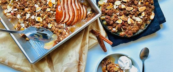 A Pear Crisp Recipe is Topped With Sliced Almonds and Crumble Topping.