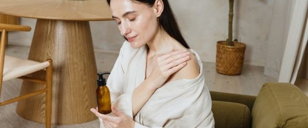 Body Oils Woman Applying Body Oils