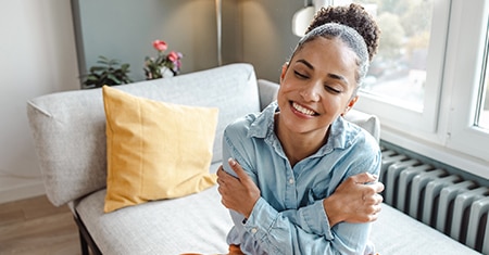 woman hugging herself