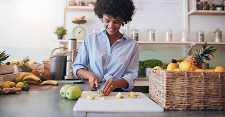 woman cutting fruit
