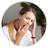 image of a woman yawning