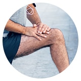 image of person rubbing their knee