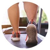 image of feet walking on a treadmill